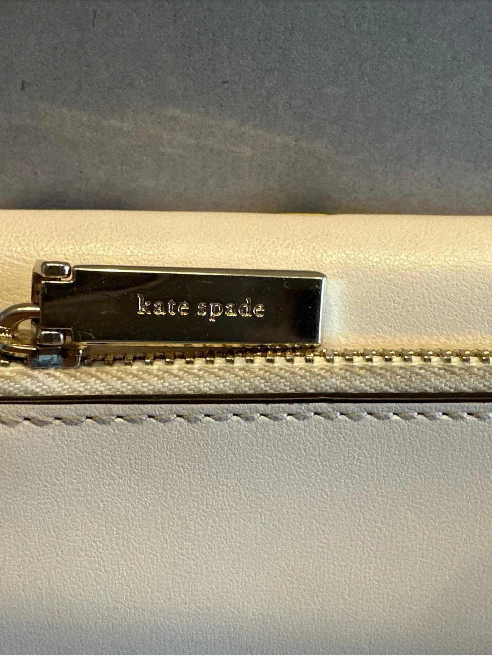 Kate Spade New York Reegan Pansy cream wallet with purple and yellow floral